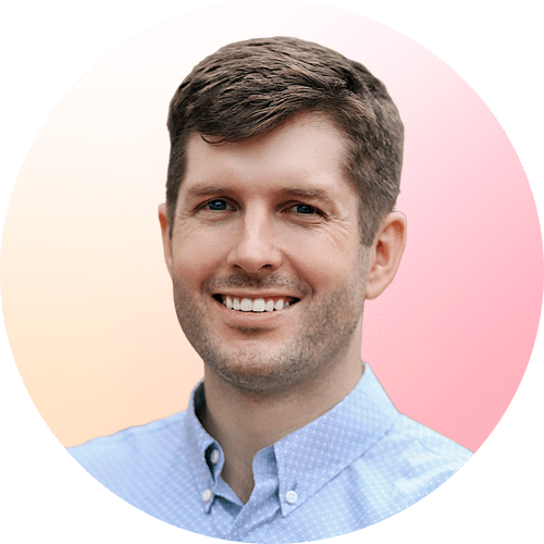 Circle-shaped professional headshot photo of Neal Kemp smiling in a pink background