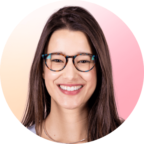 Circle-shaped professional headshot photo of Nicole Barra Conde smiling in a pink background